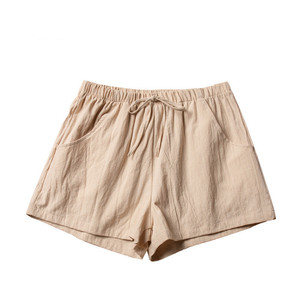Shorts en coton taille haute pour femmes avec cordon de serrage et poches, coupe ample, style décontracté, couleur noire unie - Product Image 1
