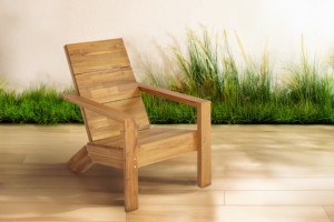Silla Adirondack diseñada con respaldo inclinado clásico, reposabrazos anchos y construcción sólida, ideal para relajarse al aire libre en jardines. - Product Image 1