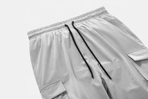 กางเกงวินด์เบรกเกอร์ลำลองสำหรับผู้ชาย แฟชั่นเรียบง่าย 6 กระเป๋า น้ำหนักเบา เอวกลาง วิธีการทอผ้าแบบไม่ถักทอ - Product Image 6