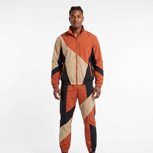 Conjunto de 2 piezas de pantalones deportivos softshell con cremallera personalizados para hombre, con ribetes y puños elásticos, chándal unisex de nailon con bloques de color y cortavientos. - Product Image 6