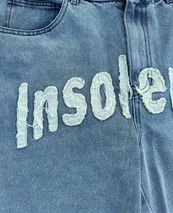 กางเกงยีนส์ขาสั้นทรงหลวมสไตล์วินเทจปี 2025 สำหรับผู้ชายและผู้หญิง ทรงขากว้าง แต่งเชือกผูก สไตล์ Y2K สำหรับฤดูร้อน ปักลายสีสัน - Product Image 2