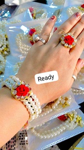 Elegant handcrafted pearl <b>bracelet</b> and matching ring set featuring a vibrant <b>red</b> rose centerpiece sparkling kundan-style stones - Product Image 2