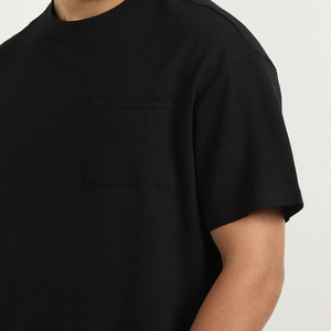 T-shirt à col rond noir pour homme avec poches latérales, décontracté, respirant, 100% coton, coupe ample, manches courtes, idéal pour l'été - Product Image 4