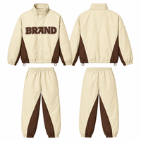 Survêtement coupe-vent imperméable 100 % polyester, avec doublure imprimée OEM, design de veste et pantalon à fermeture éclair, poids lourd, écologique