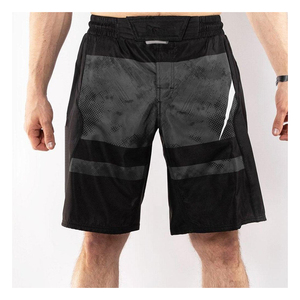 กางเกงกีฬาขาสั้นผู้ชายลายคาร์บอนไฟเบอร์ MMA & BJJ - Product Image 1