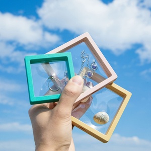 Boîte rigide transparente anti-oxydation haut de gamme avec support flottant 3D pour boucles d'oreilles et bijoux, doublée d'éponge - Product Image 1