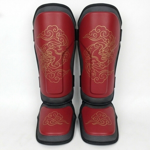 Protège-tibias de boxe unisexes pour adultes avec fermeture auto-agrippante, haute qualité, noirs avec bandes rouges élastiques - Product Image 1