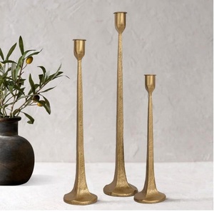 Refined <b>brass</b> candle <b>holder</b> designed for tasteful decorative arrangements in residential and hospitality settings alike - Product Image 1