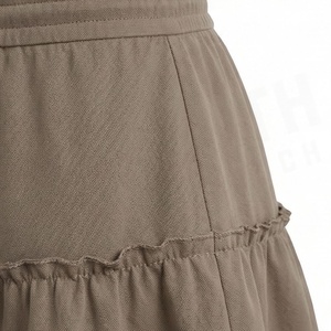 Jupe courte à volants pour femmes, taille élastique, couleur unie, design décontracté en forme de A, tissu polyester confortable, à porter en toutes saisons - Product Image 5