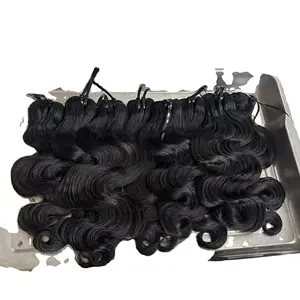 Listino prezzi all'ingrosso 100 raw remy di alta qualità extension per capelli di trama super disegnate per capelli ondulati morbidi capelli crudi vietnamiti