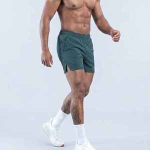Shorts en coton vert uni pour homme avec poches, taille élastique, décontractés, respirants, taille mi-haute, personnalisables - Product Image 1