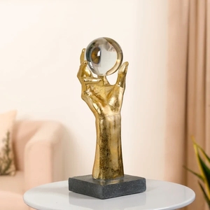 Figurine dorée de style moderniste avec globe en cristal décoratif et base solide et lourde pour bureau, armoire et étagère - Product Image 1