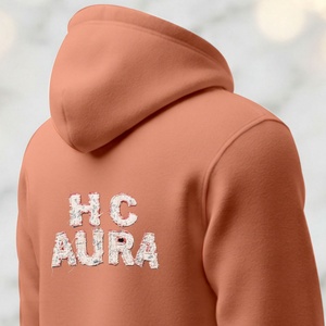 Sudadera con Capucha de Primera Calidad, Color Rosa Bebé, con Logotipo Bordado en Chenilla Personalizado, Sostenible y de Alta Calidad - Product Image 1