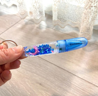 Porte-clés stylo liquide à effet de mouvement Dauphin 0,5 mm Plastique 10 cm Encre noire/bleue Promotionnel