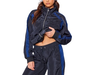 Trajes de ropa deportiva de marca con logotipo bordado personalizado, chándal de bloque de color con cremallera, chándal de nailon cortavientos de mejor diseño para mujer - Product Image 6