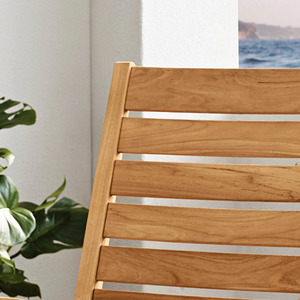 Silla mecedora Cambridge Casual Logan con estructura de madera de teca natural y asiento de listones con acabado de madera natural para uso en exteriores. - Product Image 4