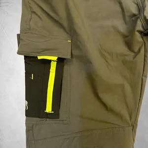 Pantalones de Trabajo Color Verde Oliva para Hombre con Paneles Negros, Ribete Amarillo, Bolsillos para Rodilleras y Bolsillos para Herramientas - Product Image 5