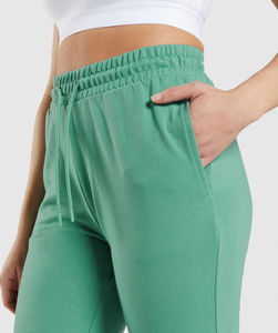 กางเกงสตรีทแวร์สีพื้นทรงหลวมสไตล์ลำลอง กางเกงสตรีทแวร์น้ำหนักเบา กางเกงวอร์มขาย - Product Image 4