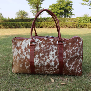 Premium cowhide leather hair on travel <b>bags</b> wholesale supplier OEM custom logo handmade export fashion luggage <b>bags</b> for sale - Product Image 1