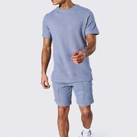 Ensemble de survêtement décontracté pour homme en coton tricoté 100 % uni, respirant et sans coutures, avec logo personnalisé, deux pièces, t-shirt et short