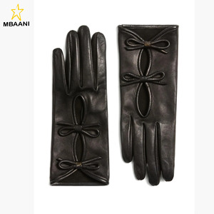 Women's black Leather fashion <b>Gloves</b> with bow and cut out detailing - Product Image 1