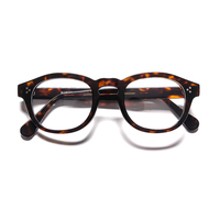 Montures de lunettes optiques en acétate transparent rondes ambre à monture complète épaisse avec détails rivetés pour la vente en gros personnalisée