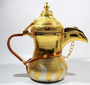 Exquisite golden dallah showcasing a unique woven texture and silver flame accents. Available at wholesale price. - Product Image 1