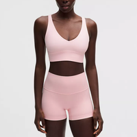 Ensemble de yoga rose sans couture pour femme, composé d'un crop top à col rond et d'un short taille mi-haute, avec soutien-gorge de sport convertible à bretelles en Spandex/Nylon, idéal pour l'entraînement.