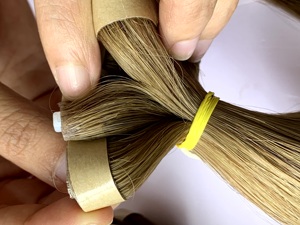 Venta al por mayor de alta calidad Invisible sin costuras cutícula alineada cinta inyectada extensiones de cabello humano vietnamita ondas naturales barcos - Product Image 4