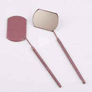 Matte Pink Stainless Steel Wall Mounted <b>Magnifying</b> <b>Makeup</b> <b>Mirror</b> with Textured Handle for Precise Application and Powder Use - Product Image 1
