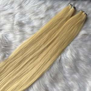 Vente en gros d'extensions de cheveux vietnamiens bruts de qualité supérieure, faisceaux blond clair, cuticule alignée complète, épais de la trame aux pointes - Product Image 2
