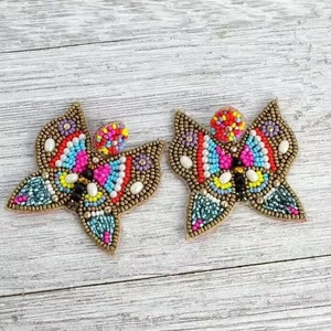 handcrafted beaded butterfly <b>earrings</b> Beads Embellished Hand Crafted Parrot <b>Stud</b> <b>Earrings</b> from the brand BaubleBar <b>Earrings</b> - Product Image 3
