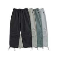 Maßgeschneiderte Unisex Loose Fit Fallschirmhose Baggy Streetwear Techwear Hose Gorpcore Elastischer Bund Kordelzug Verstellbare Bündchen
