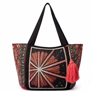 Bold <b>black</b> tote <b>bag</b> with intricate starburst beadwork, colorful side panels, and tassel accent. Perfect statement handbag - Product Image 1
