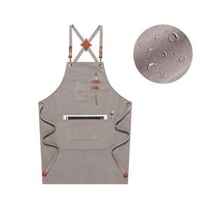 Tablier de styliste en toile personnalisé avec sangle en cuir réglable à dos croisé, gilet professionnel avec poches pour équipement de barbier et de toilettage - Product Image 1