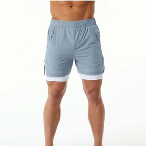 Men's Light Blue Quick Dry Sport Shorts With Pockets Elastic Waist <b>Mid</b> Length Solid Color Knitted Polyester - Product Image 1