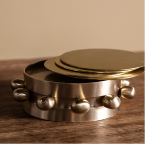 Textured <b>gold</b> sunburst metal <b>coasters</b> with center holes stacked on a wooden central spindle, available at wholesale prices. - Product Image 3
