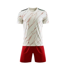 Conjuntos de uniformes de fútbol por sublimación OEM al por mayor en tela de poliéster transpirable manga corta sólida color blanco y rojo personalizado - Product Image 1