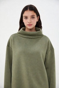 Stylish woman in bright bubblegum <b>pink</b> mockneck <b>sweatshirt</b> featuring elegant lace details on neckline and hem with oversized rel - Product Image 4