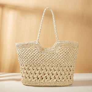 Experience effortless elegance with this stunning Natural yarn bag featuring a carved <b>top</b> line and a patterned bottom accent - Product Image 1