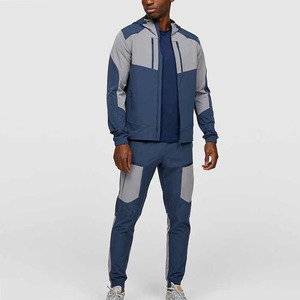 men's <b>zip</b>-<b>up</b> tracksuits. Modern contrast-panel design with sharp <b>white</b> accents and comfortable tapered joggers. - Product Image 1