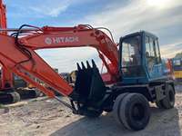 Excavatrice sur pneus Hitachi EX100 d'occasion, d'origine japonaise, engin de construction, MOTEUR ISUZU ZX120