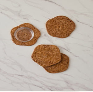 Vibrant orange fringe rim woven straw coaster mats adding modern style to dining room <b>tables</b>, available at wholesale prices. - Product Image 2
