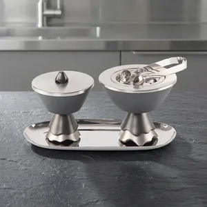 Ensemble de brûleurs d'encens gris mat moderne sur un plateau argenté poli, avec des bases en forme de pilier cannelé et des pinces métalliques élégantes assorties - Product Image 1