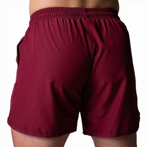 Shorts pour hommes à couleur unie, séchage rapide, avec cordon de serrage, taille mi-haute, décontractés, pour la gym et l'entraînement, en tissu polyester, avec poches - Product Image 3