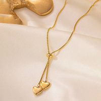 Collier tendance en acier inoxydable doré avec pendentif cœur et détails incrustés, idéal pour les cadeaux de bijoux pour couple