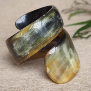 Brazalete de cuerno de búfalo natural con diseño de serpiente en espiral de Perfect Enterprises - Product Image 1