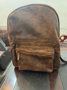 Sac à dos vintage en cuir marron pour ordinateur portable, unisexe, avec double poignée, fermeture éclair, boucle, étiquette et plusieurs compartiments, idéal comme bagage cabine - Product Image 1