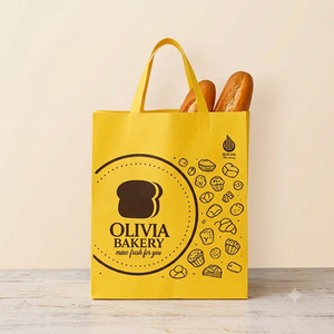 Bolsa de tela no tejida amarilla reutilizable con impresión personalizada y sellado térmico para panadería - Product Image 1