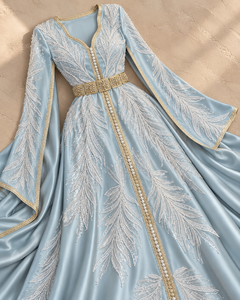 Caftán Maxi Argelino Elegante de Mishkat Couture en Azul Polvo con Bordado de Perlas, Terciopelo Color Ciruela, Mangas Tipo Capa con Abertura, Adornos de Plumas y Cuentas, Estilo Musulmán - Product Image 1